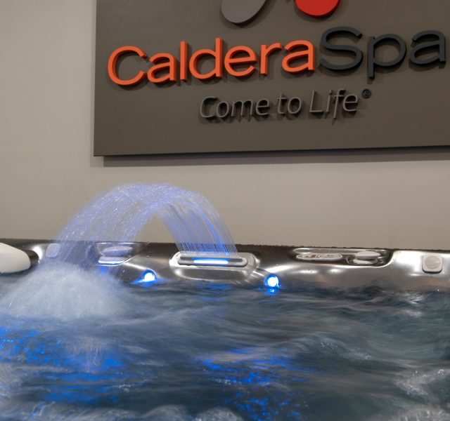 Caldera Spas sign in background, close up of spa in foreground