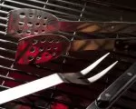Thumnbail of Grill accessories: bbq tools resting on grill