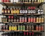 Thumnbail of BBQ sauces and hot sauces on shelves in store at Outdoor Living, Collierville, Memphis TN