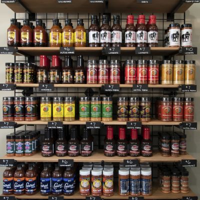 BBQ sauces and hot sauces on shelves in store at Outdoor Living, Collierville, Memphis TN